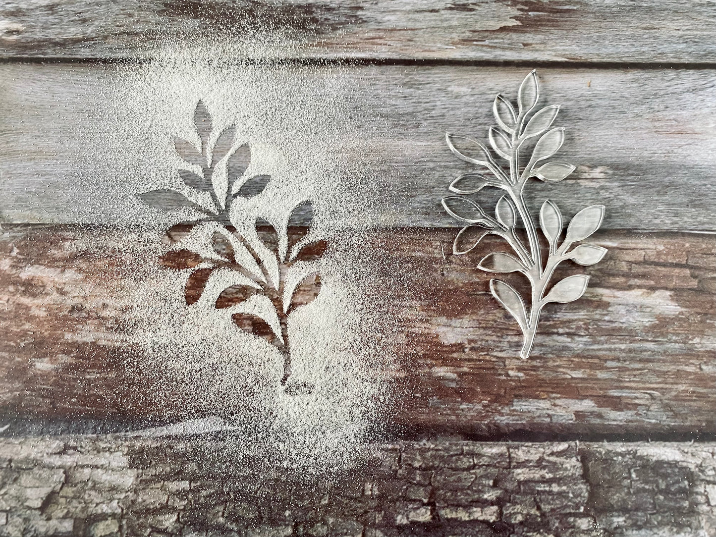Acrylic leaf-shaped object on a wooden surface